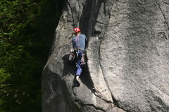 Rock Climber crawling up a crevice