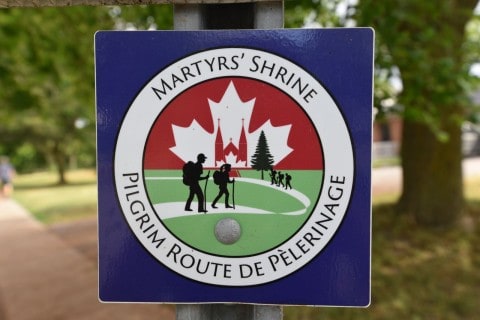 Martrys' Shrine sign and trail marker Canadian Camino in Ontario Canada.