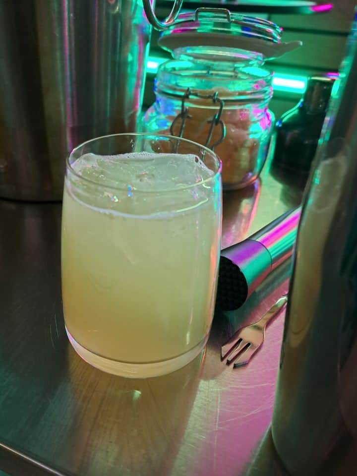 Gin cocktail with melon liqueur, St Germain, lemon juice and soda water at Halo Bar Bistro in Alberta Canada