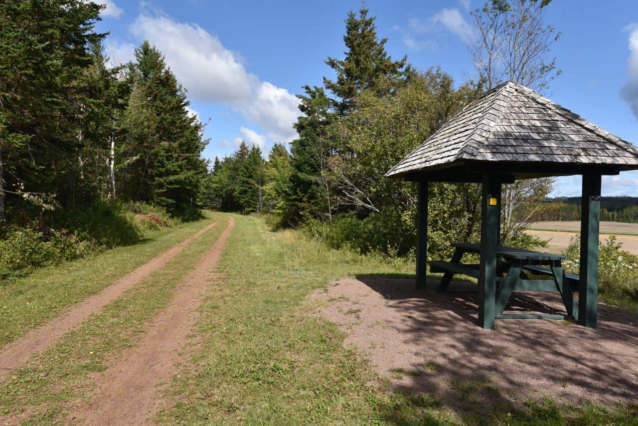 Amenities like benches, pit toilets, and rest stops are plentiful along the Confederation Trail in Prince Edward Island, Canada.