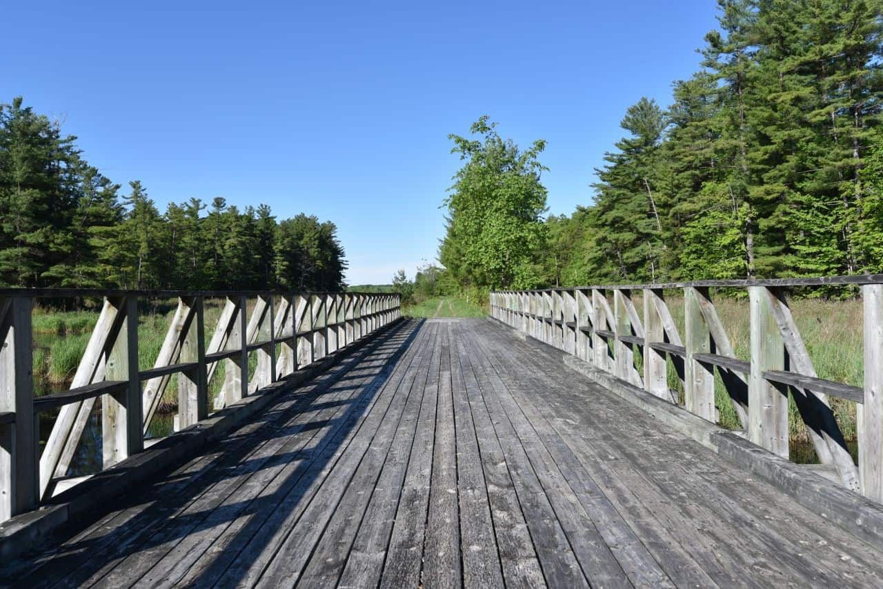 Trestle bridges and wooden footbridges make hiking and biking the Cataraqui Trail, Ontario easy and fun