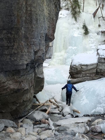 Crossing over an ice bridge on the Maligne Canyon Icewalk in Jasper National Park.