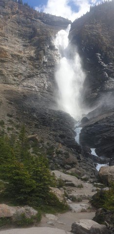 The walking trail to Takakkaw Falls leads adventure seekers close enough to the base of the waterfall to feel the mist.