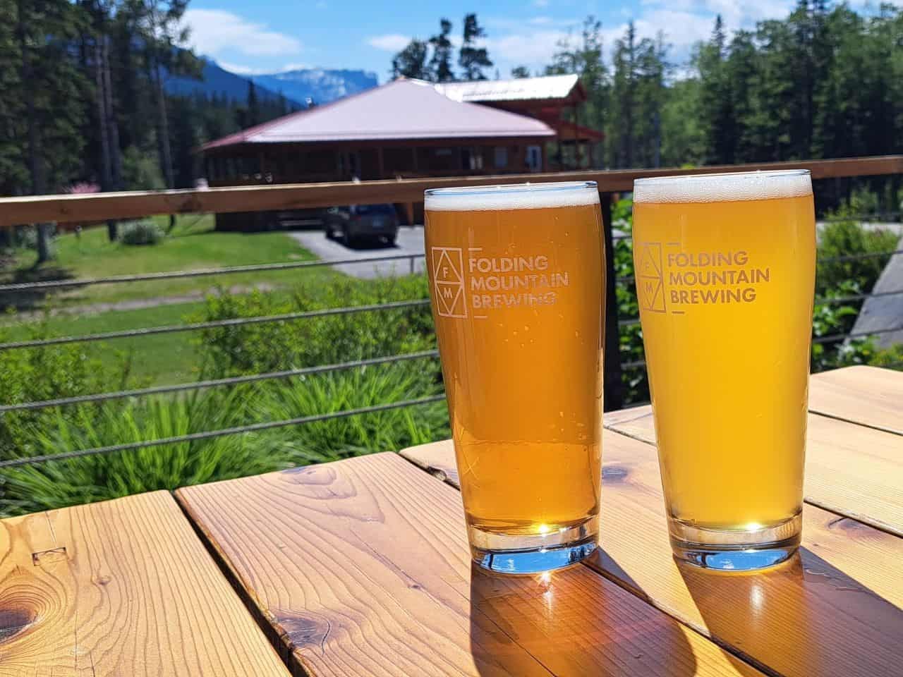 Two cold craft beers being enjoyed on a hot sunny day on the Folding Mountain patio in Alberta Canada