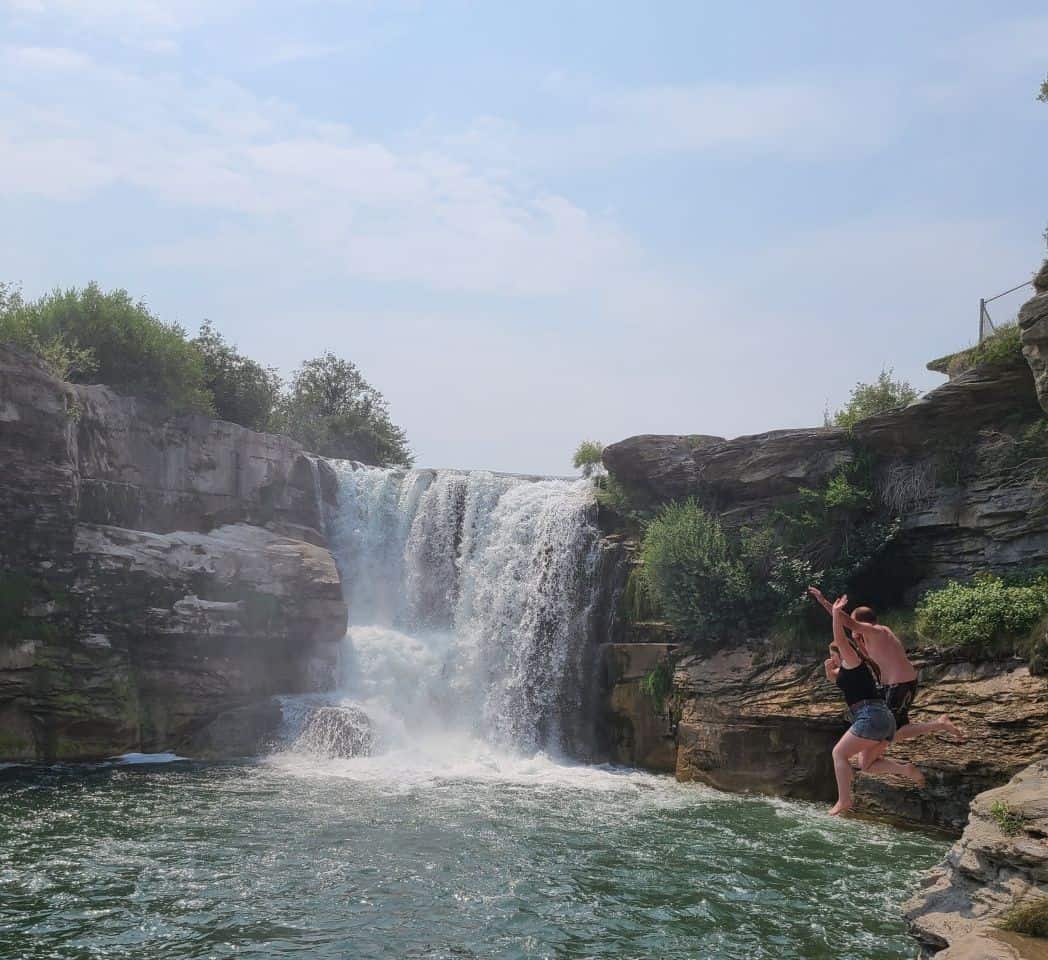 Swimming at a waterfall in southern Alberta called Lundbreck Falls in the Lundbreck Provincial Recreation Area