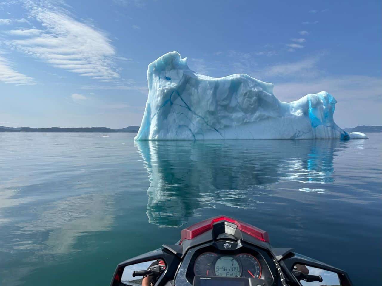 Reflections of an iceberg during Summer in Newfoundland and Labrador Canada from a jet ski.