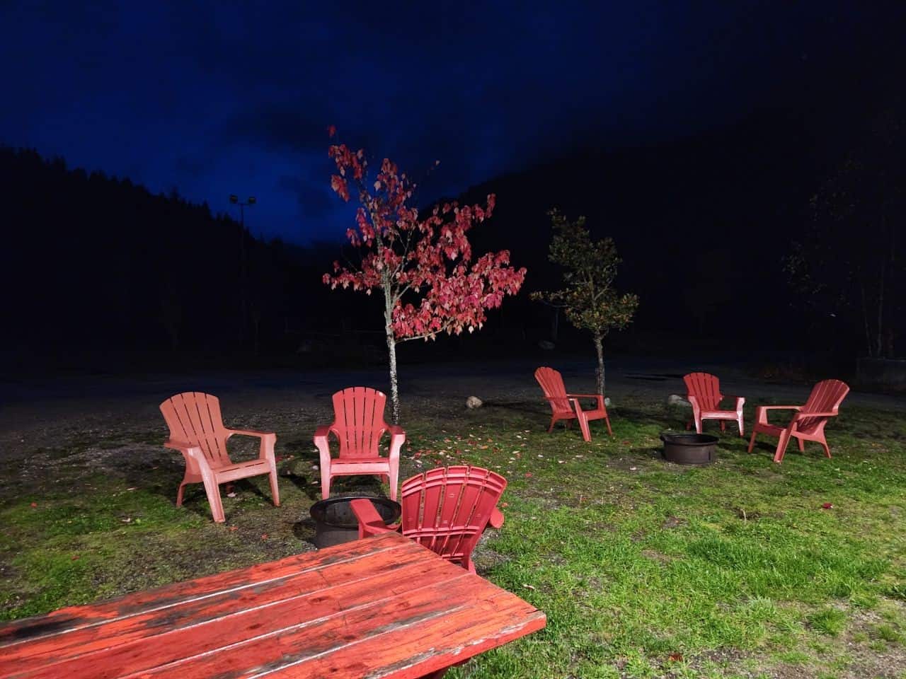 Outdoor campfire pit with sitting area at the Crazy Creek Resort and Hot Pools in BC Canada