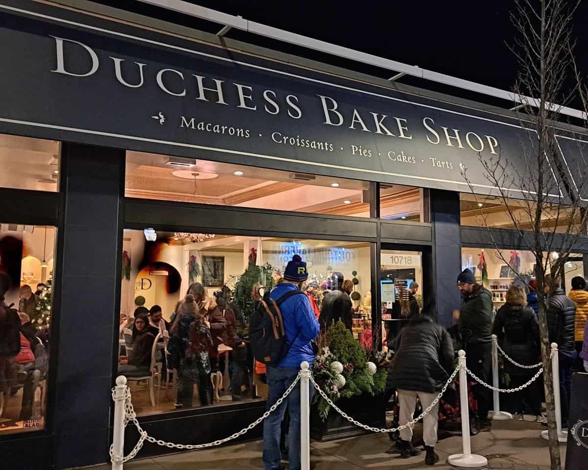 People line up to get into the Duchess Bake Shop for a peak at the massive gingerbread creation during the All is Bright Festival on 124 Street in Edmonton