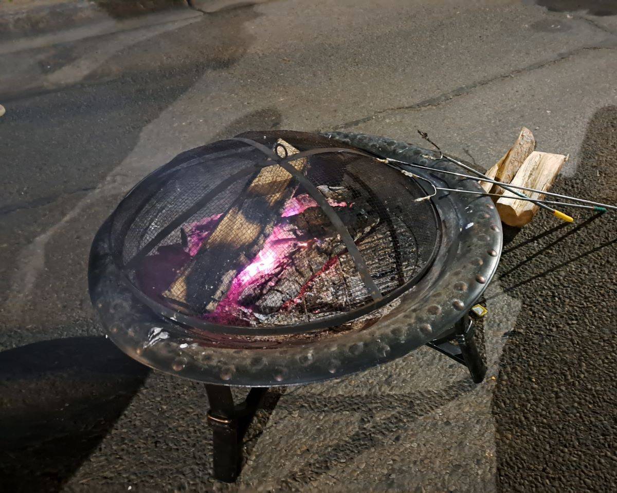 Fire pits for keeping warm and roasting marshmallows line the 124 Street All is Bright Festival Area in Edmonton.