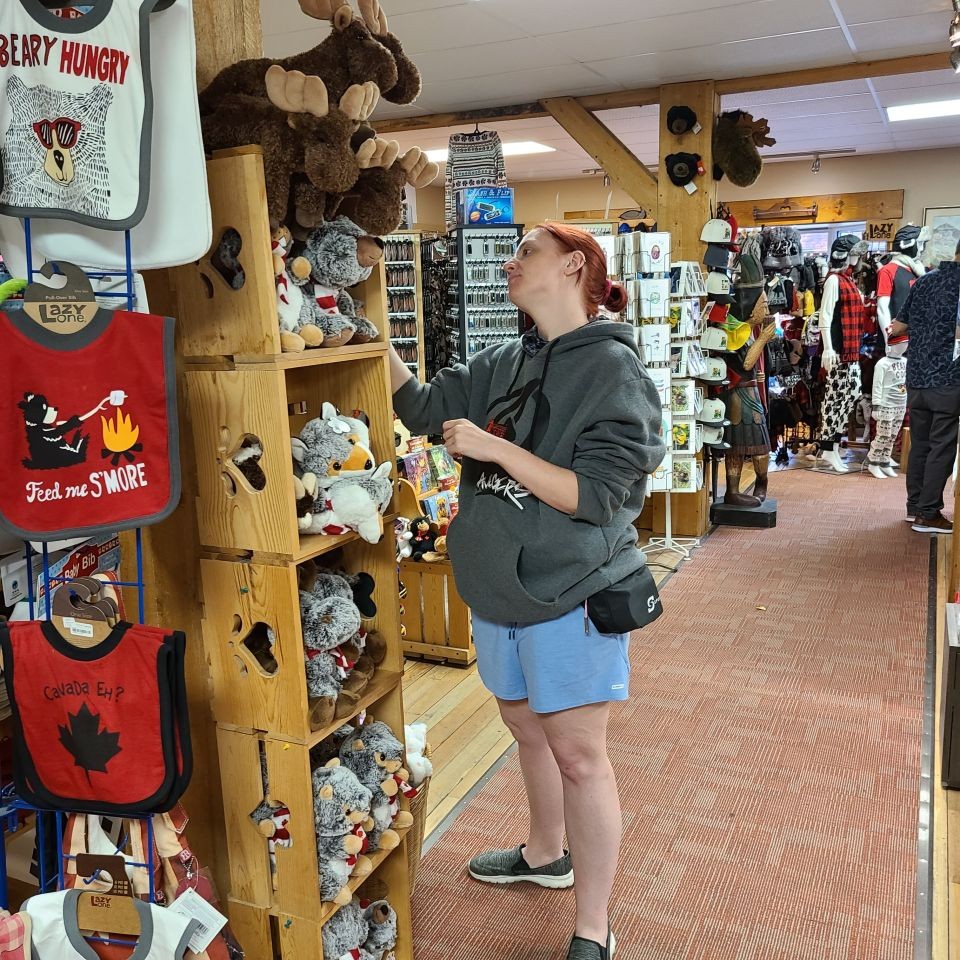 A friendly tourist from Ontario visits Waterton Lakes National Park in Alberta Canada. Shopping is a great activity to enjoy here in town. There are a variety of options for shops and restaurants in Waterton during the summer