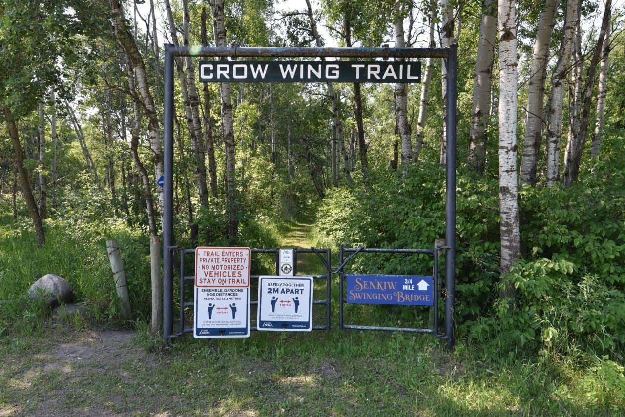 This wooden gate marks a peaceful, wooded section of the Crow Wing Trail near Senkiw Bridge, blending history and nature along Manitoba’s Chemin St. Paul for a true Canadian Camino experience.