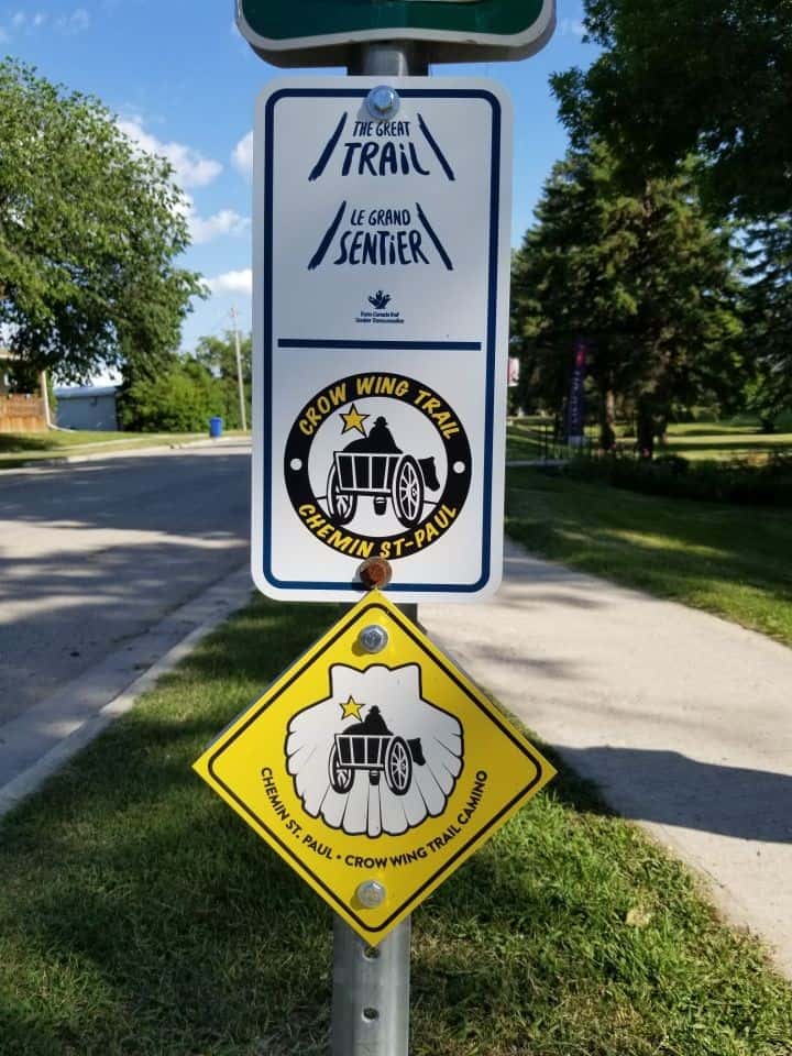 Trail signage marks the Crow Wing Trail as the Chemin St. Paul, guiding pilgrims through southern Manitoba and reinforcing its status as a recognized Canadian Camino pilgrimage route.