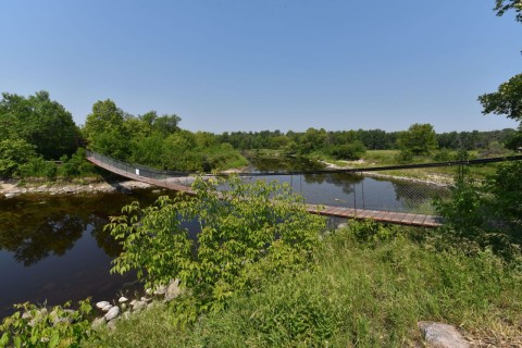 The Senkiw Suspension Bridge, gently swaying over the Roseau River, is a memorable highlight of the Crow Wing Trail / Chemin St. Paul, offering pilgrims a symbolic passage through Manitoba’s prairie history.