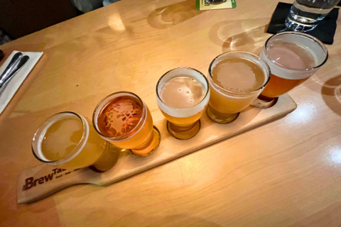 Five delicious local craft beers on a wooden board at the Brew Table, Kanata, Ontario