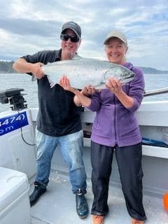 Port Hardy Fishing Charters on Vancouver Island with some of their clients fishing salmon.