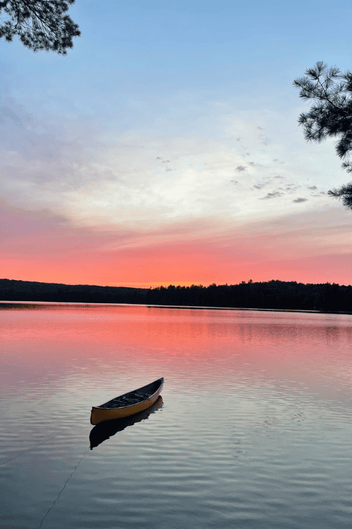 A bear canoe out in one of the lakes in Algonquin Park at sunset.