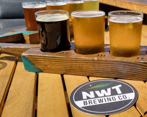 The NWT Brewing Company is Canada' northernmost brewpub. In the image, adventure seekers enjoy a flight of local beers.