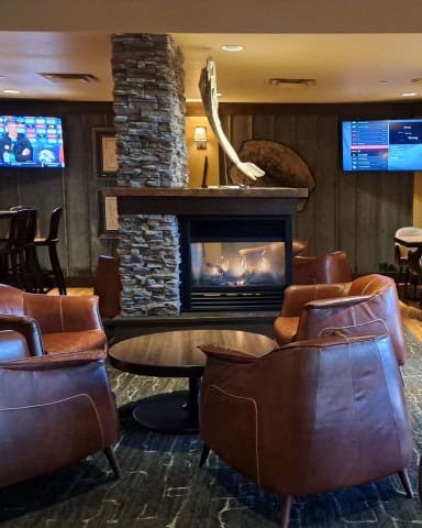 Trapline Lounge has comfortable seating for weary adventurers with a cozy fireplace to sooth the bones.