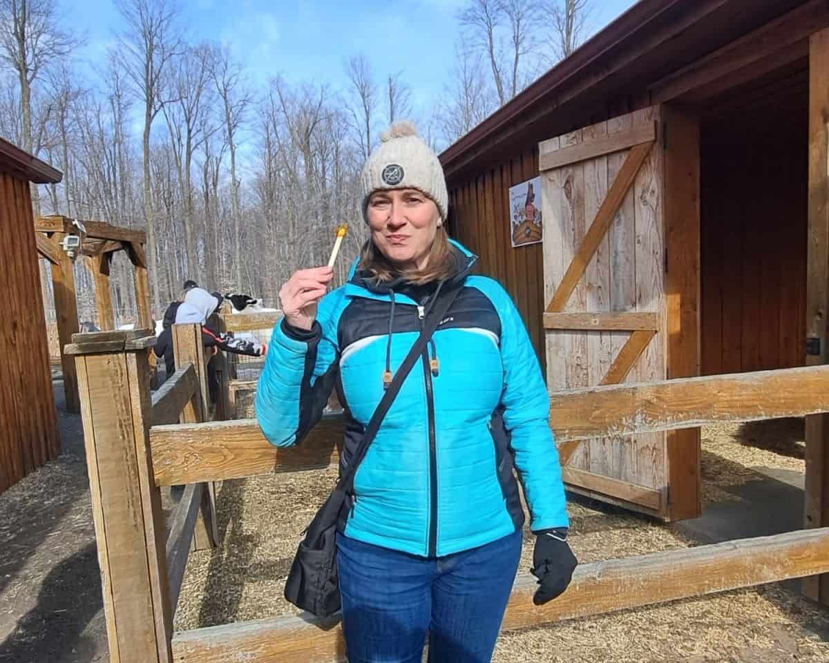 After a full maple syrup themed meal in the sugar shack, visitors head outside for maple syrup taffy. The syrup is boiled and poured onto fresh snow. As it starts to set, visitors roll it up with a popsicle stick to enjoy this sticky treat like a lollipop. It is a highlight of maple syrup season in the spring in Quebec.