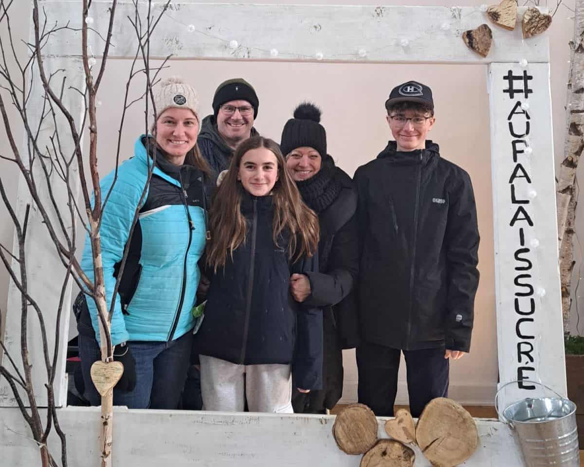 Friends and family can pose for a photo at the selfie station in the Au Palais Sucré sugar shack just south of Montreal Quebec Canada. A sugar shack is a large barn style restuarant that is onely open 2-months of the year during maple syrup season.