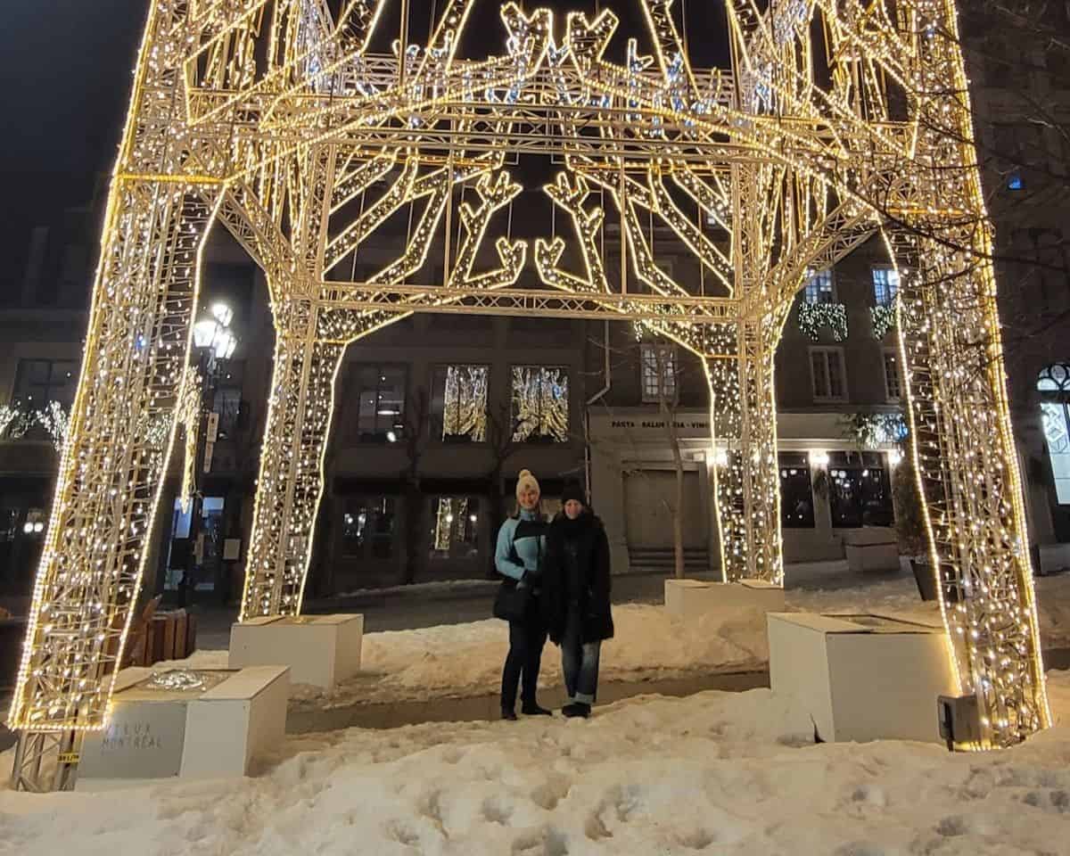 A large 3 dimensional white Christmas light style gazebo in Old Montreal is lit up at night in the City of Montreal in Quebec.