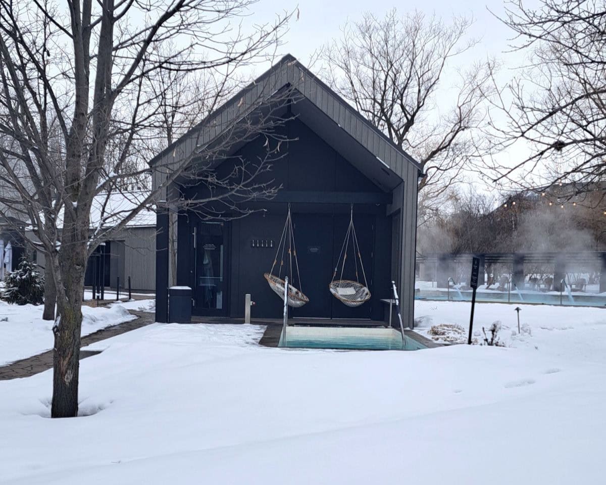 Strom Nordic Spas have a variety of Scandinavian style buildings connected by walkways through a snowy garden. This buildling has indoor and outdoor relaxation areas.
