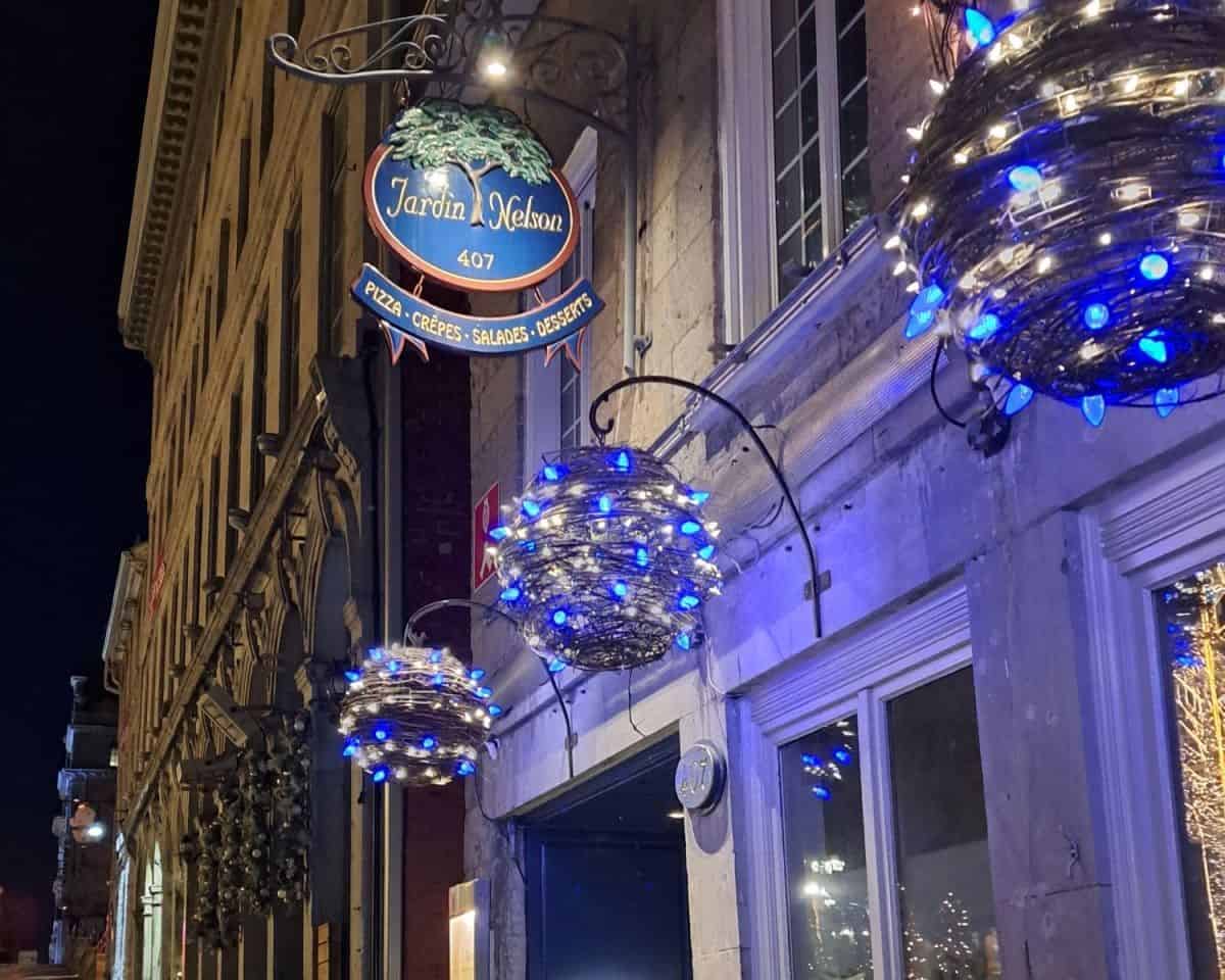 Jardin Nelson in Old Montreal Quebec Canada is lit up at night. This is a very popular restuarant in the City of Montreal. This is a must-see destination for culinary, historic and cultural tourism when in Montreal.