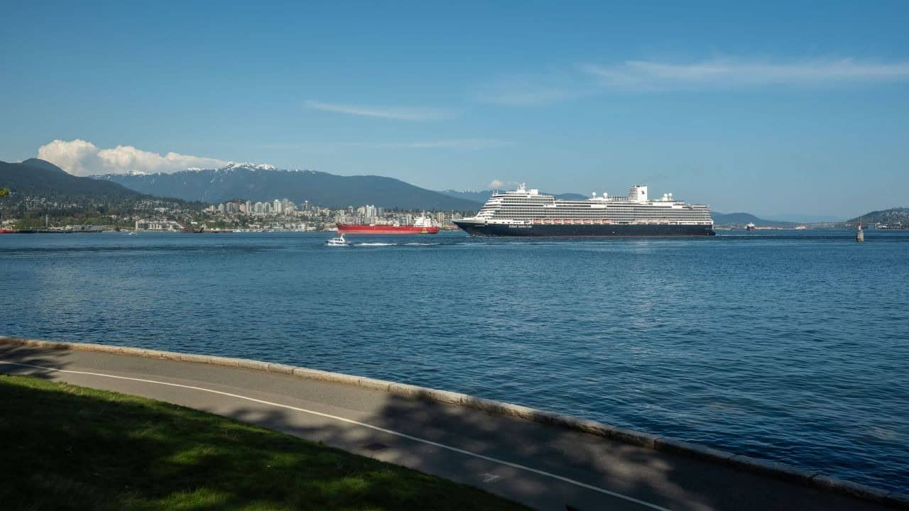 Vancouver British Columbia Canada: How To Balance Work With Adventure. Cruise ship escorted from Vancouver Harbour