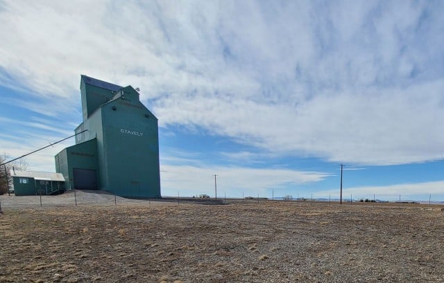 Grain elevator in Stavely Alberta Canada dominates the skyline.