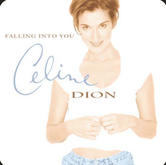 Celine Dion stands with her hands together over her stomach from her Falling Into You album