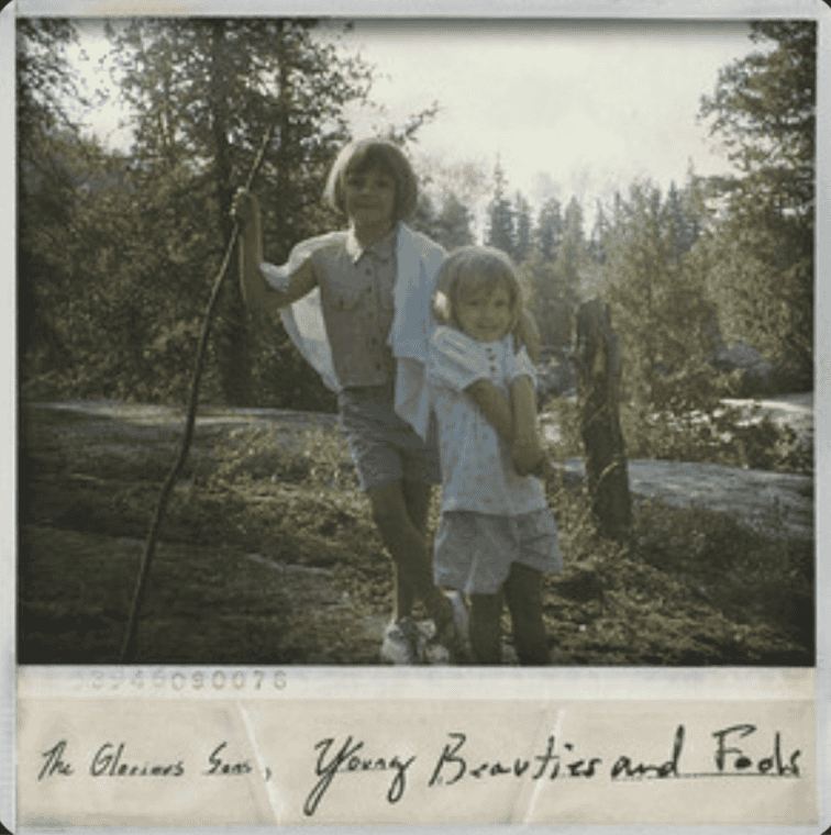 Retro photograph of two young children smiling in the woods. Glorious Sons' album cover from Young and Beautiful Fools
