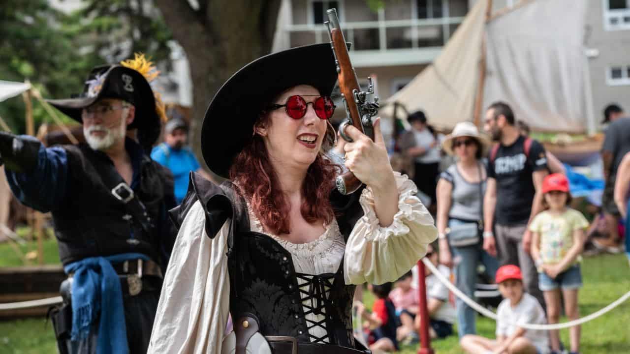 Woman Dressed As A Pirate With A Pistol
