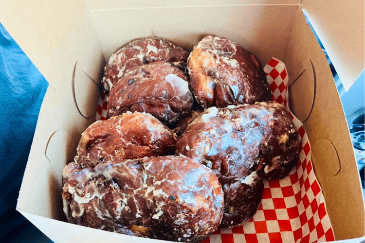 Fresh, warm, apple fritters from Batchawana Bay packed in a to-go containers