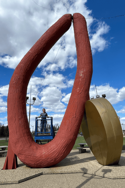 Blue sky, fluffy white clouds, World's Largest Sausage, Mundare, Alberta