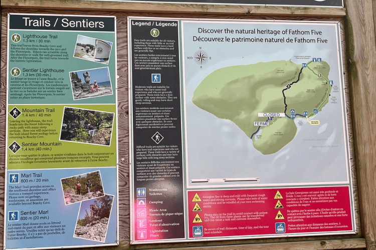 Sign showing the trail and island maps and warnings on Flowerpot Island.