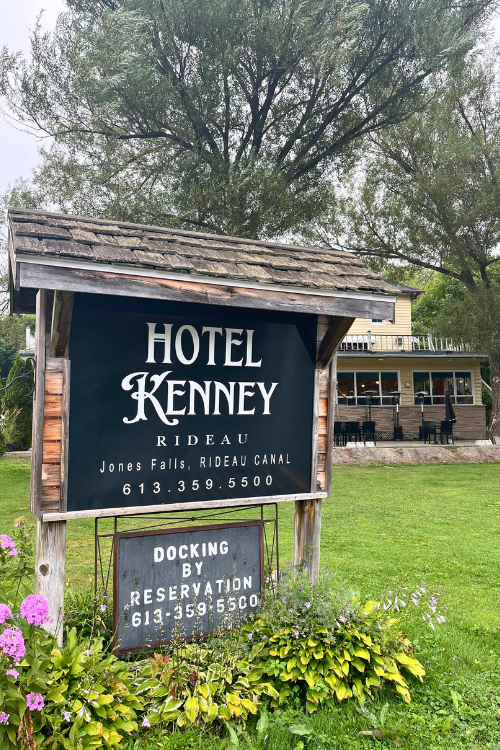 Hotel Kenney on the Rideau Canal, Jones Falls, Ontario, sign as seen from the waterfront.
