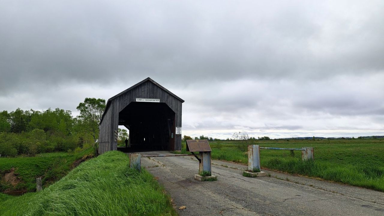 A historic covered bridge in New Brunswick is an ideal stopping point during any slow travel adventure.