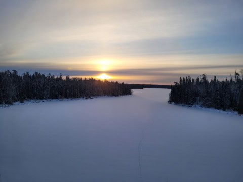 Northern Ontario’s winter landscapes unfold from VIA Rail’s The Canadian, with frozen lakes, snow-laden pines, and rocky Canadian Shield terrain defining the opening day of this transcontinental train journey.