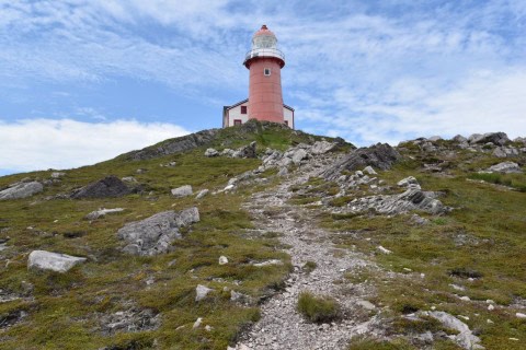 A coastal footpath leading to a lighthouse in Atlantic Canada highlights the Trans Canada Trail’s eastern routes, where rugged shorelines, ocean views, and maritime heritage shape the hiking experience.