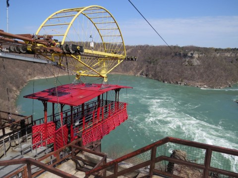 View of the Niagara Whirlpool Rapids and Whirlpool Aero Car along the Niagara River Recreational Trail in Ontario, Canada, showcasing dramatic river currents, gorge landscapes, and unique sightseeing experiences for visitors.