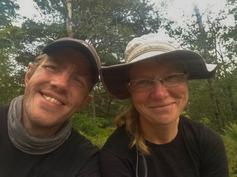 Selfie of Come Walk With Us hiking on the Niagara River Recreational Trail in Ontario, Canada, capturing a personal travel experience along the scenic route with views of the Niagara River and surrounding landscapes.