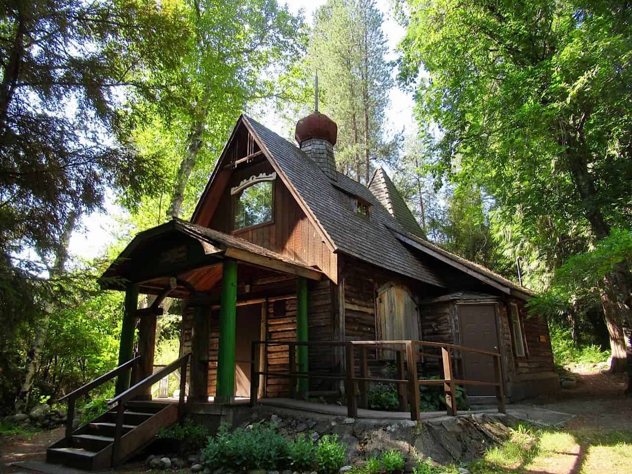 Russian Orthodox style wooden building tucked in heavily-treed landscape in Castlegar BC.