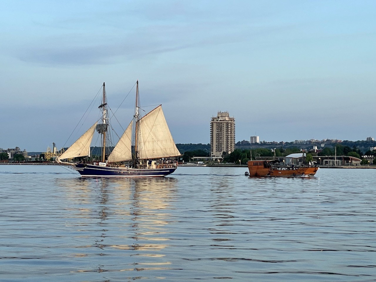 Boats in Hamilton Harbour Ontario Canada - A variety of different boats can be found in Hamilton Harbour. This particularly evening we came across one of the tall ships and a pirate ship used for entertainment in the Hamilton Harbour.