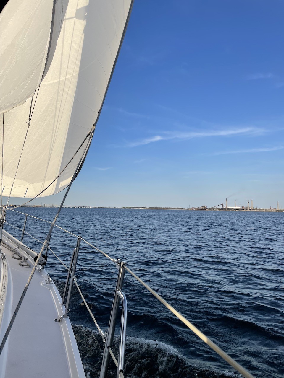 Sailing in the Hamilton Harbour Ontario Canada - A blue sky and just the right amount of wind made for the perfect conditions for an evening sail before the sunset on the Hamilton Harbour in Ontario, Canada.