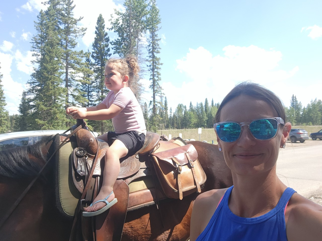 Horseback Riding in Bragg Creek - Bragg Creek offers some unique and amazing events throughout the year. Little Seeker got to ride her 1st horse near the Bragg Creek Trading Post. There are a few fantastic equestrian tour guides in this area that can take you out riding