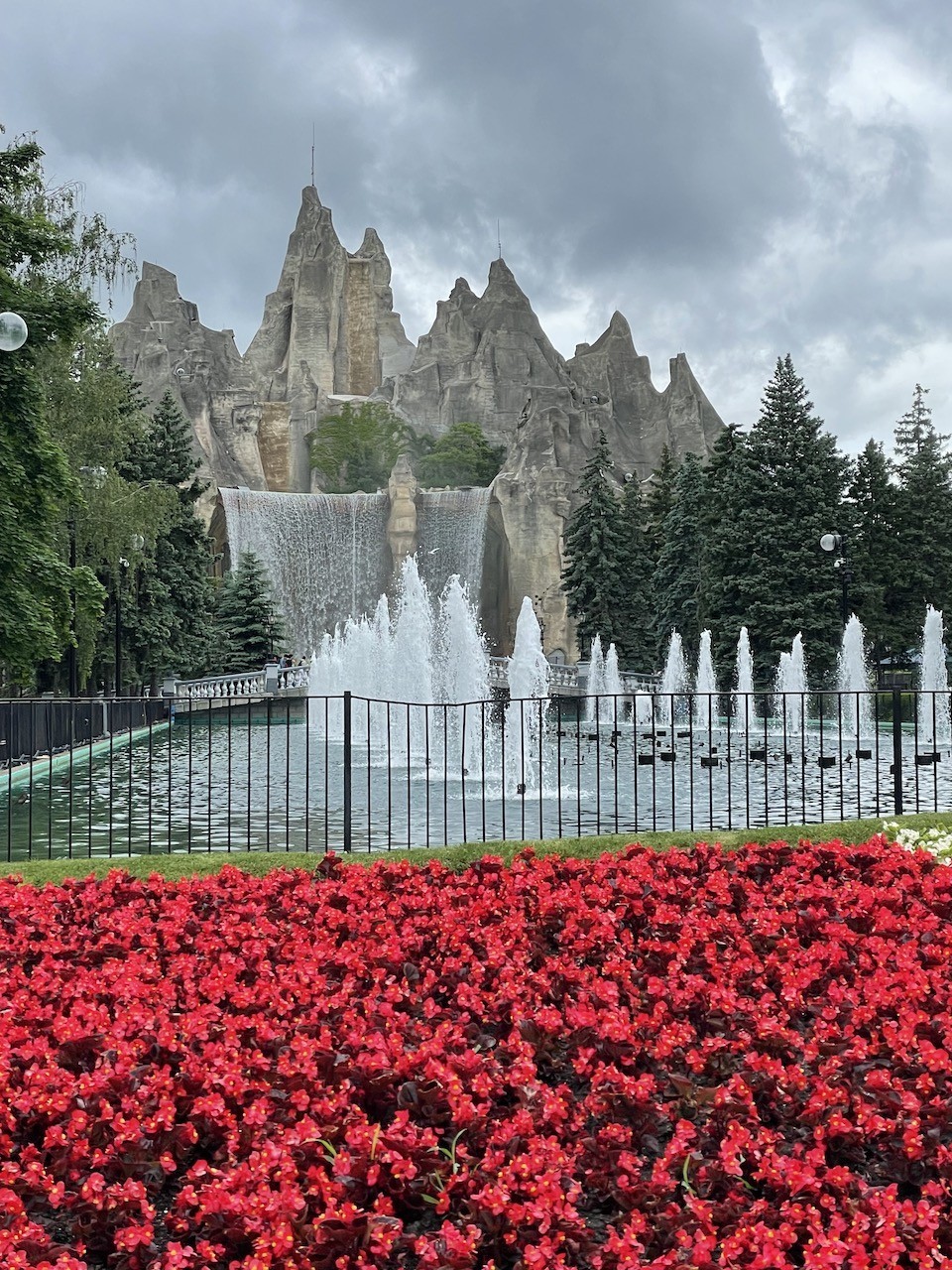 Canada's Wonderland Entrance Vaughn Ontario - As soon as visitors walk through the front gate at Canada's Wonderland, they are welcomed with this the iconic waterfall, fountain and flowerbed view in Vaughan, Ontario. 