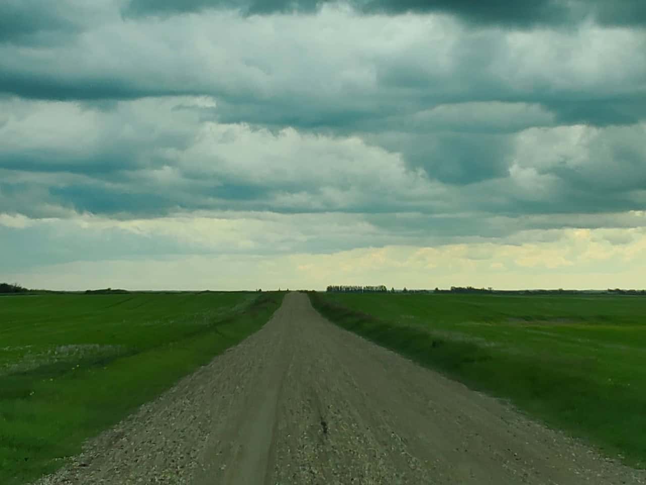 Side road near Fort Qu'Appelle Saskatchewan 2024-09-17 - This is a little side road on my way to Fort Qu'Appelle. The dark storm clouds continue to gather.