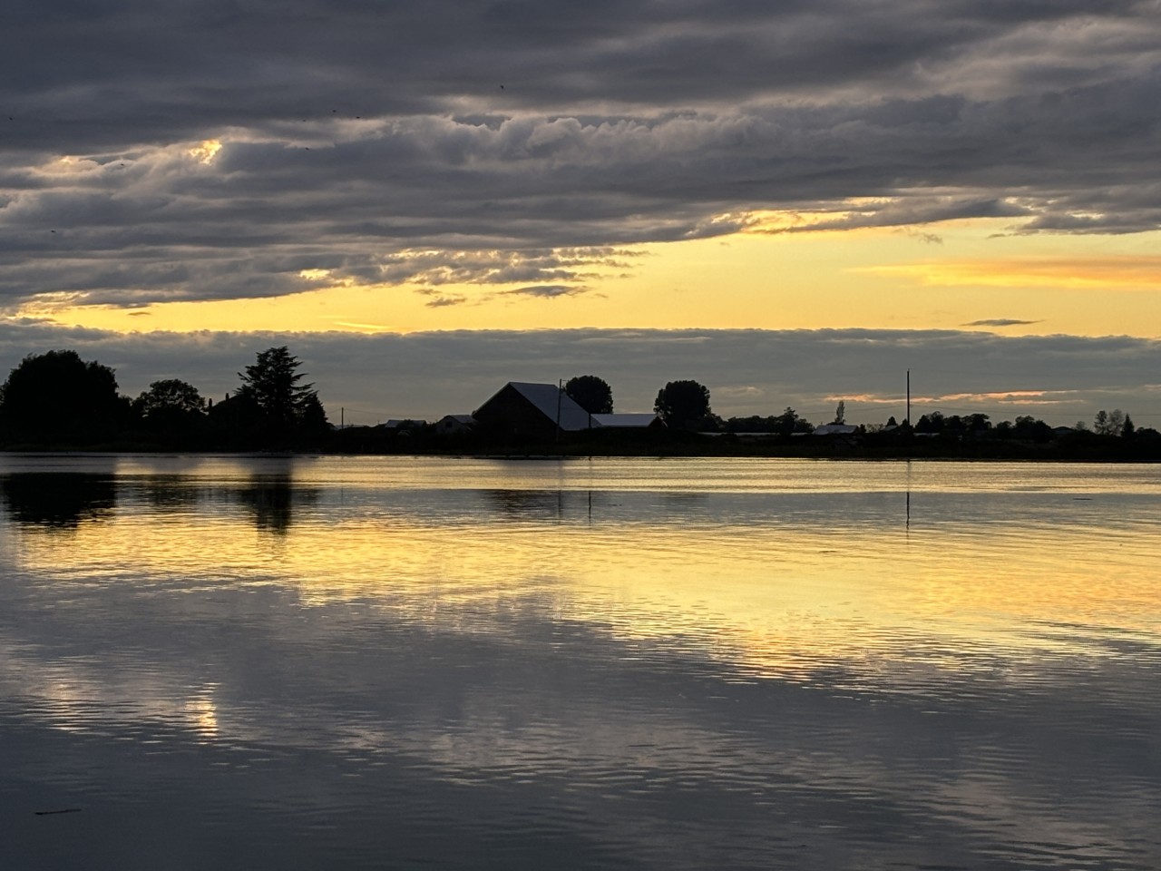 Looking across the Fraser River at Westham Island at sunset 2024-09-25 - River Road West in Delta is a great place to go near sunset. This photo is looking across the Fraser River to Westham Island at day's end.