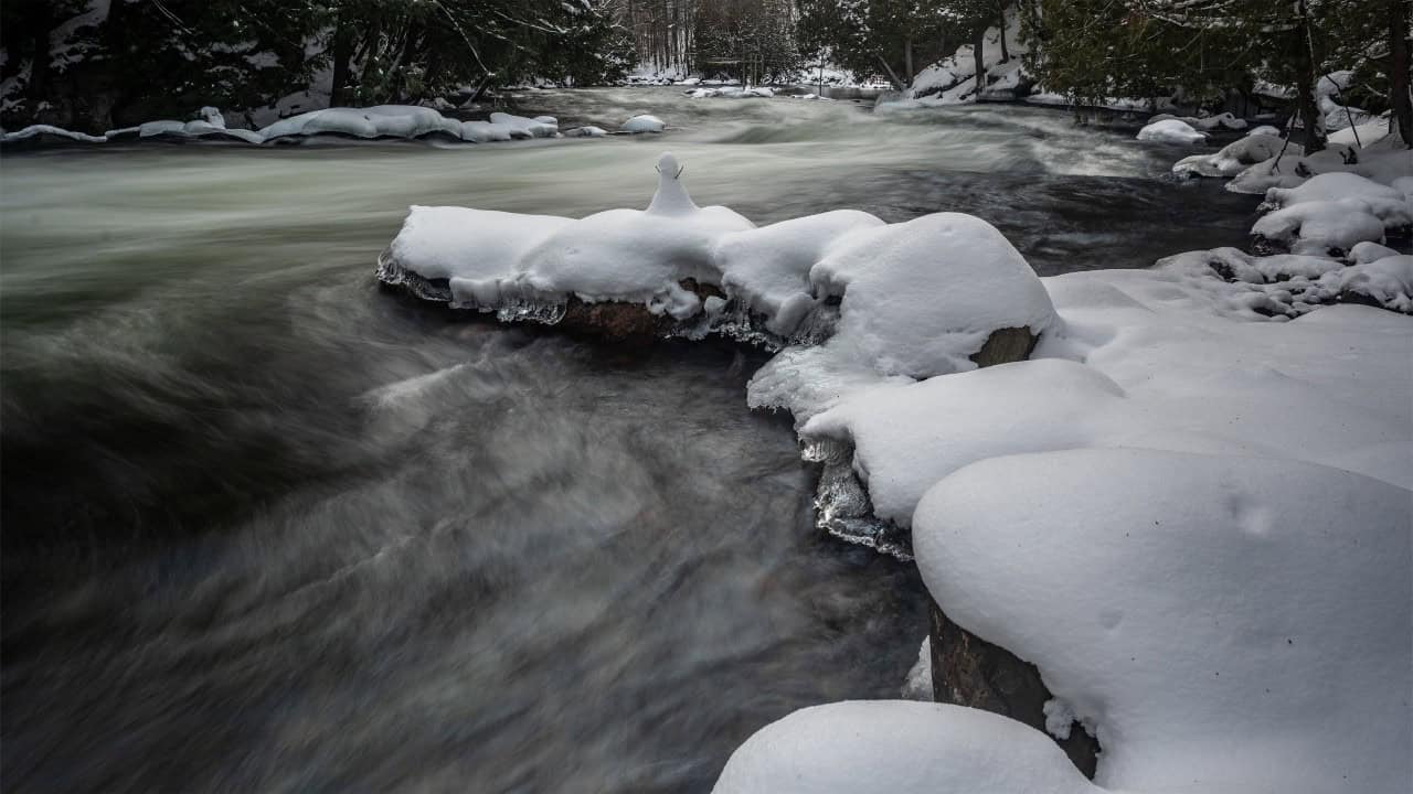 Snow Capped Boulder - Snow capped boulders make for great contrast in winter especially on a moving river.