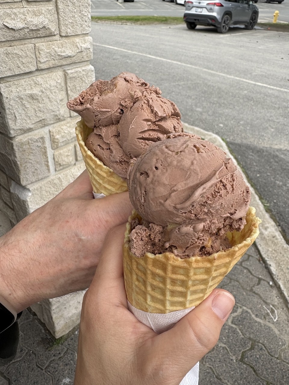 3-Cows-and-a-Cone-Peanut-Butter-and-Chocolate-Wafffle-Cones - Peanut butter and chocolate ice cream is my all time favourite ice cream. The creamy chocolate ice cream and peanut butter chunks mix together in the most delightful way at 3 Cows and a Cone in Manitoulin Island, Ontario, Canada.